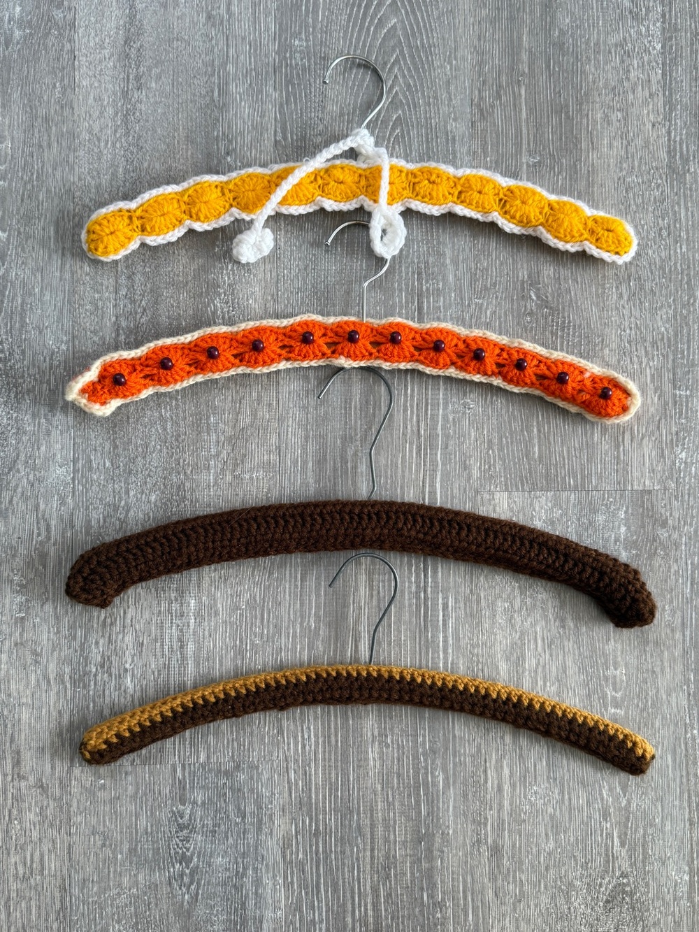 4 vintage hand crocheted  wood hangers